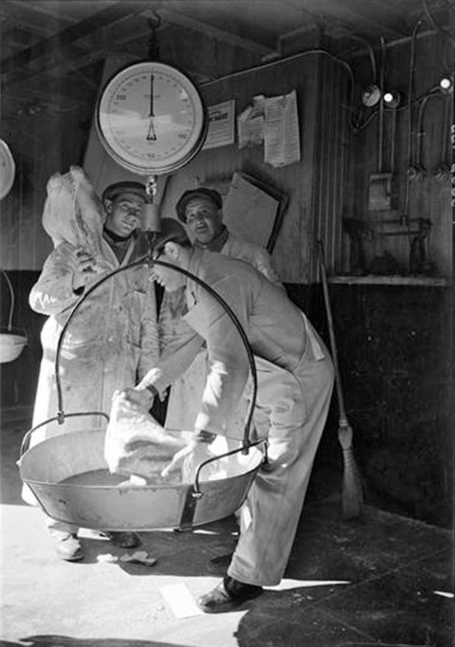 Workers weighing beef at the West Washington Market in the Meatpacking District, 1938.Photo: Sol Lib