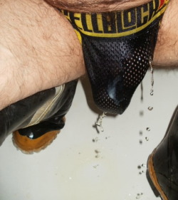mansmells:   jockdog69 submitted:  Dripping Wet ManSmells: Slurp! I’m such a pig, love the rubber boots and mesh jock with the piss. Wish I was laying under this guy.  