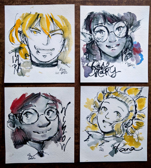 maiji: [image: photo of ink-and-watercolour portraits of four webcomic characters on squares of pape