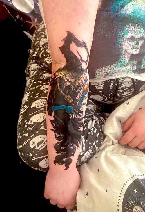a photo of a salecrow tattoo on PJ's forearm