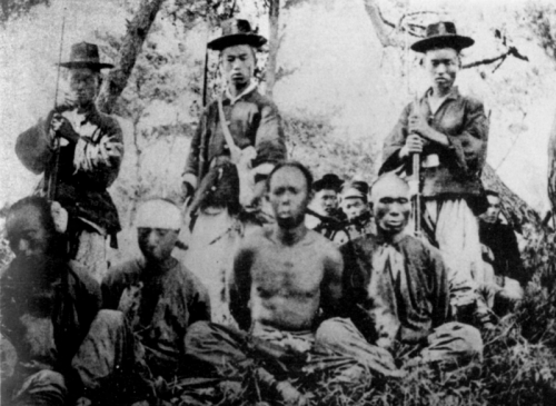 Korean soldiers guarding Japanese prisoners, 1st Sino Japanese War, circa 1894-1895.
