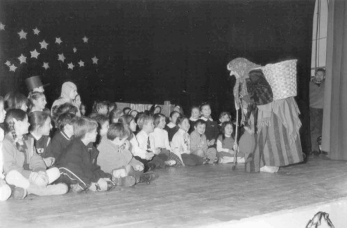 Befana giving her presents to children on Epiphany Eve (January 5)