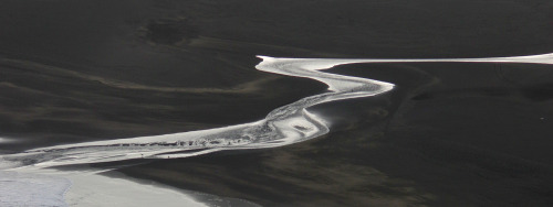 Whatipu Stream where it finally pushes through the sand dunes and reaches the Tasman Sea.