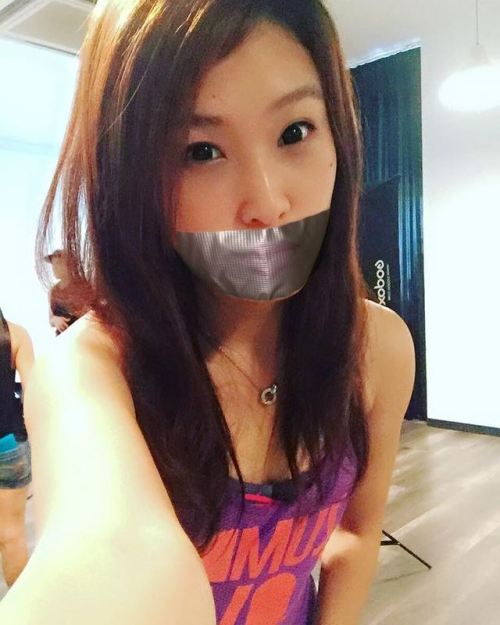 Asian girl fake tape gagged Tape gagged girl