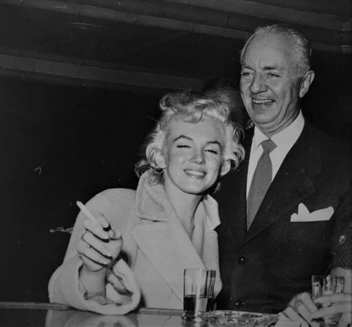 perfectlymarilynmonroe:Marilyn Monroe with William Powell at the Palm Springs Racquet Club, December