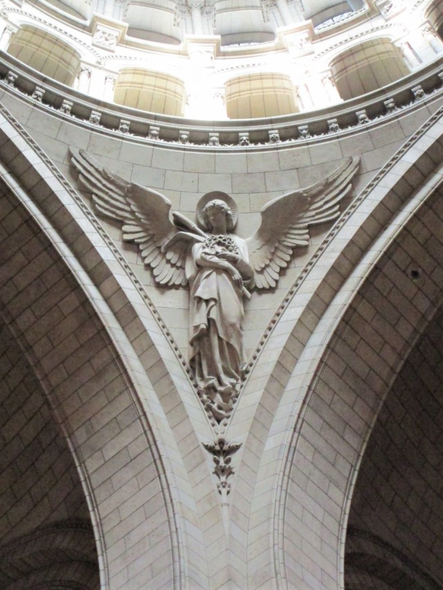 The central dome of Sacré-Cœur Basilica in ParisPhotos by Charles Reeza #angel#stone carving#architecture#neo-romanesque#Paris landmarks#catholic church#France#travertine stone
