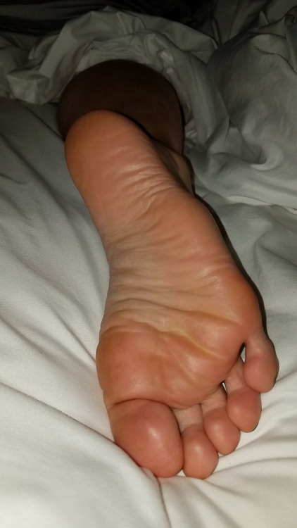 myprettywifesfeet:My pretty wifes cute sleepy sole poking out of the covers.please comment