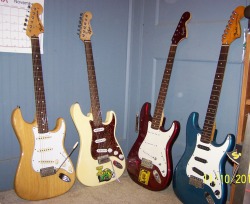 fuckyeahfenders:  Left to right: 2003-2004 Fender Stratocaster (1970’s reissue); 2009 Squier Stratocaster; 2004 Squier Stratocaster (first guitar); 1977 Fender Stratocaster (got from my dad; it was his first Stratocaster).  My mouth is watering&hellip;