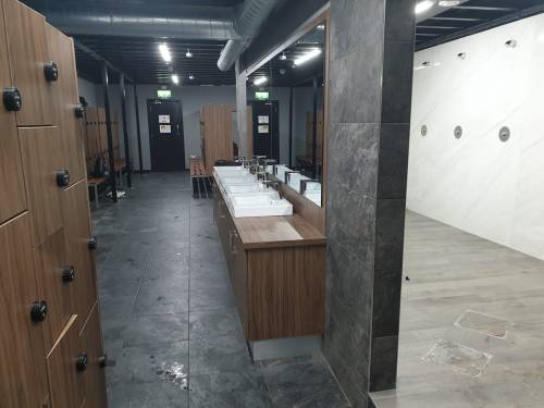 Men’s locker room and showers at Straight Blast Gym in Dublin, Ireland.This gym and locker room were