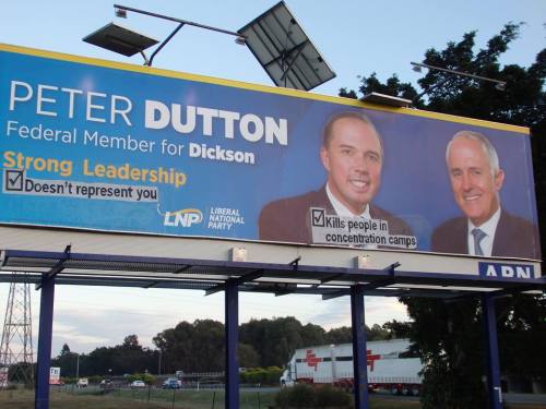 Vandalised election billboard for Peter Dutton, the scumbag politician in charge of Australia’s offs