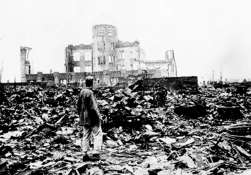 unhistorical:   Hiroshima, August 6, 1945; Nagasaki, August 9, 1945.    In time I came to an open space where the houses had been removed to make a fire lane. Through the dim light I could make out ahead of me the hazy outlines of the Communications
