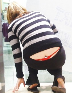 kevclem2:  Couldn’t believe my luck with this bit of window shopping. In the shop window with her thong on show, love it!