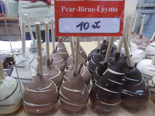 Fruits in chocolate offered for sale during Christmas market in the city Wroclaw, Poland.