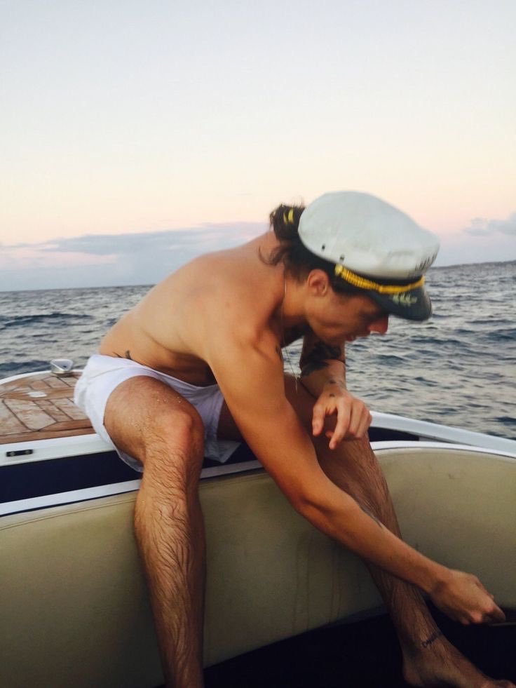 hairycelebs:  lovesunsetroyal: Harry Styles on a yacht photographed by his mother.