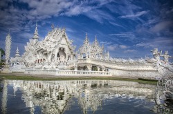 archiemcphee:  This spectacular white building is called Wat Rong Khun or The White Temple. It’s a Buddhist temple located in Northern Thailand just outside the city of Chiang Rai. Designed by Thai visual artist Chalermchai Kositpipat in 1997, The White