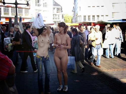bestofexhibition:  Girl undressing in a very public market #exhibition #public #nude #street 
