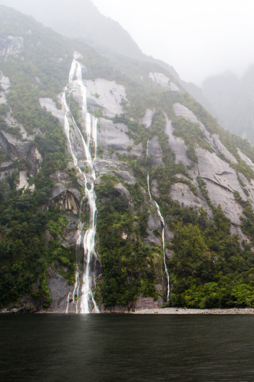 Sheer valley walls and waterfalls at Milford Sound.Milford Sound, Fiordland, South Island, New Zeala