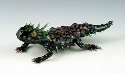 sixpenceee:  Incredibly Colorful Hand-Blown Glass Creatures By Scott Bisson Scott Bisson is an Oregon-based glass blowing enthusiast. Ever since he bent a piece of glass over a flame in his high school Chemistry class when he was seventeen, Bisson has