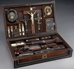 isaybelow:  Vampire slaying kit from 1890s &ldquo;Cased vampire killing kit, in a rosewood and ebony case with inlaid silver stringing and mother-of-pearl inlaid plaque. Contents include a black powder percussion 2-barrel pistol, a powder horn and bullet