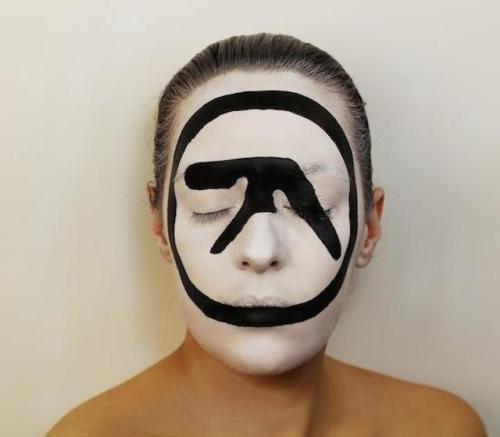 Painted faces showing famous album coversby Natalie Sharp