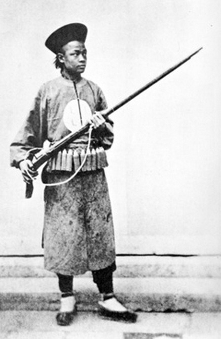 A Chinese Imperial soldier (Qing Dynasty) armed with a matchlock musket, Taiping Rebellion, mid 19th