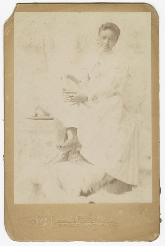 Photograph of a woman sitting with her legs crossed, late 19th century, Smithsonian: National Museum