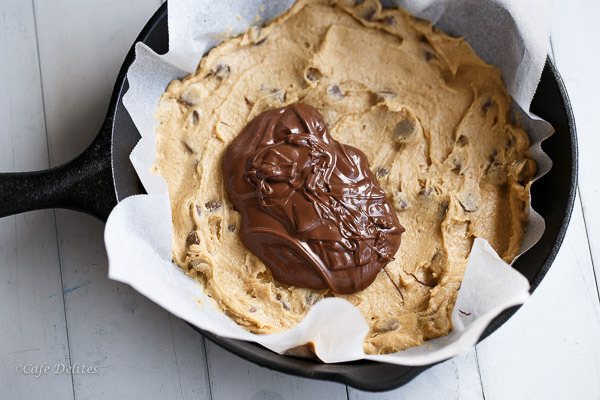 Nutella Stuffed Deep Dish Chocolate Chip Skillet Cookie - Cafe Delites