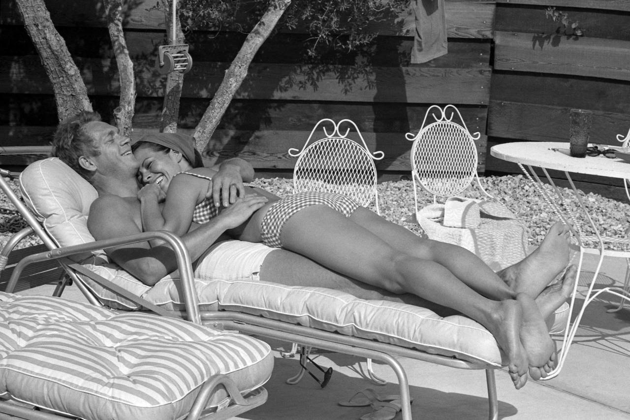 electricstateco: Steve McQueen and his wife Neile Adams lounge on the patio by the