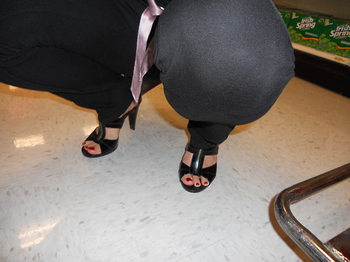 Then we stopped by the store to get a bottle of wine and some other things for the party.Â  Hubby snapped a few of me shopping.Â  Then back into the car for the drive to the party.Â  I propped my feet on the dash while he drove, and on the steering wheel
