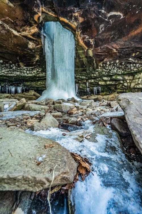 This frozen beauty right here is the Glory Hole, a waterfall through the top of a bluff shelter in t