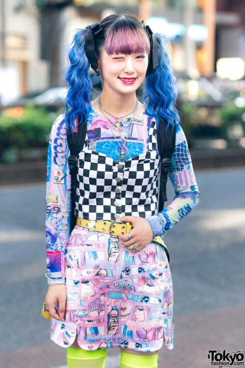 tokyo-fashion:  Hiyoko on the street in Harajuku wearing a checkered crop top over a graphic Spinns long sleeve top, a manga print skirt, a Sprayground Marvel backpack, and Demonia platform shoes. Full Look