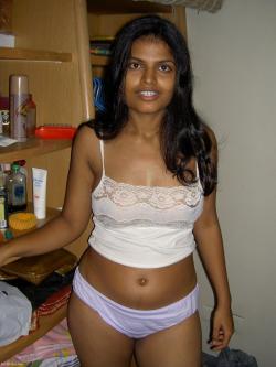 fuckingsexyindians:  Indian poses nude and spreads her wet pussyhttp://fuckingsexyindians.tumblr.com