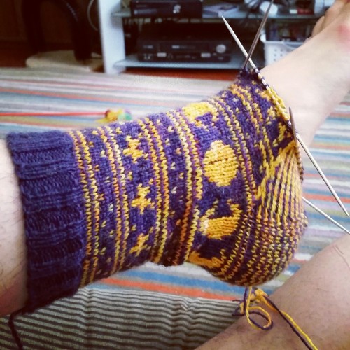 yarnaddiction: havinghorns: Socks are going, slowly. I thought the striped bottom would be cool, but