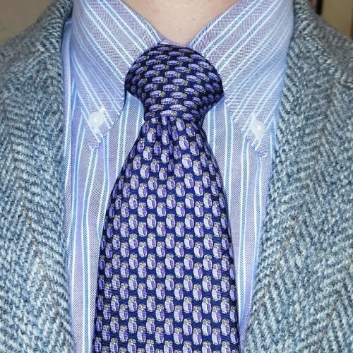 Might have a little too much going on here.  But grey herringbone blazer with a purple-and-blue