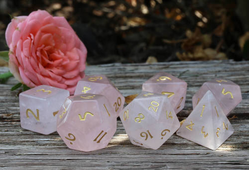 Almost got stung by a bee taking this picture of the Pink Quartz gemstone dice - lol.