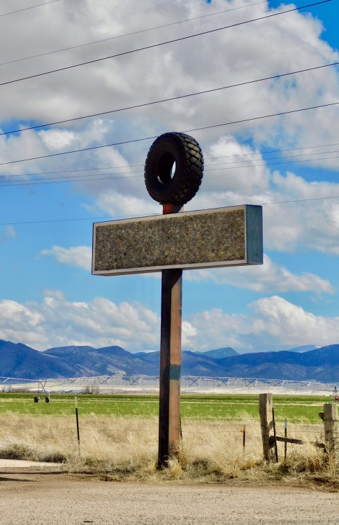 Tire and Blank Sign in Front of an Irrigated Field, Enterprise, Utah, 2020.