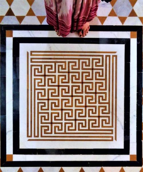 Swastikas at temple floor, India