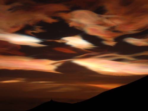 Nacreous clouds vs iridescent cloudsThis image shows polar stratospheric clouds (also known as nacre