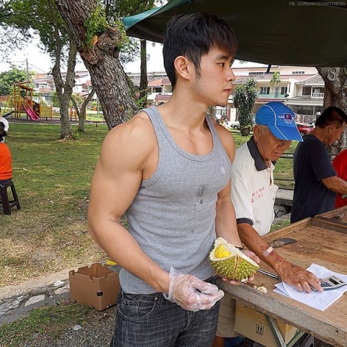 keepemgrowin:  buzzfeed:First, there was the Hot Bean Curd Vendor in Taiwan. Now there’s a Hot Durian Fruit Seller in Malaysia. This is a good trend. Forget the fruit… can I take this muscle hottie home?