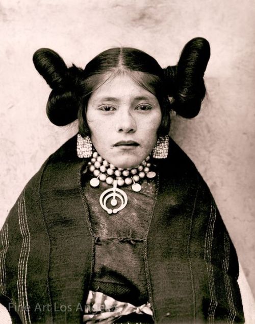 jeannepompadour:Hopi maiden with squash blossom hairstyle, 1901 The pendant in the middle of the nec