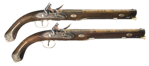 A matching set of engraved and gold inlaid flintlock pistols with Liege (Belgian) proof marks.  Late