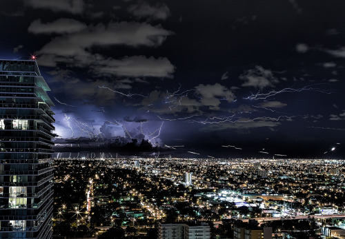 awkwardsituationist:  lightning over the skies of miami photographed by lostINmia from his apartment 
