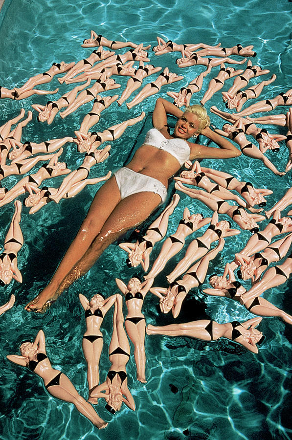 Jayne Mansfield posing in her pool with water bottles in her image, 1957. Photos by Allan Grant for LIFE magazine