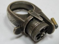 sixpenceee:The following is a real gun ring with a tiny bullet. It is specifcally called the Dyson LePetit protector ring. 