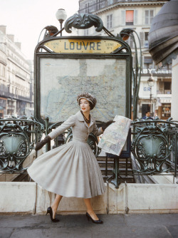 wehadfacesthen:Model wearing an afternoon dress by Christian Dior in a photo by Mark Shaw, Paris, 1957