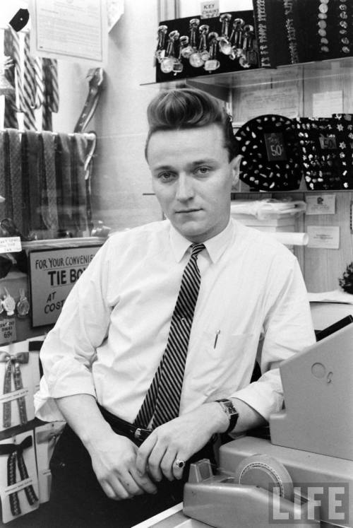 Sales clerk photographed for reaction to a newspaper strike(Carl Mydans. 1962)