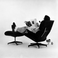 christianrichardrice:  Charles Eames posing in the Lounge Chair, Photo for an Advertisement, 1956 © Eames Office LLC