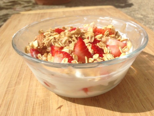 Breakfast Greek yogurt, strawberries, and granola.  I basically made myself a parfait. And mean how 