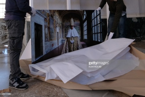 The Italian photographer Gianni Fiorito and his assistant prepares the prints before the exhibition 