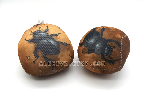 some dung beetle dung balls made with a squishy stretchy fabric and lightweight bead interior. perfe